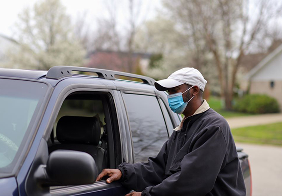 A person getting into a car