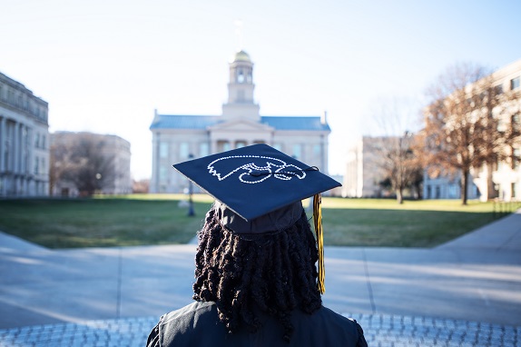 A student onlooking the old capitol building