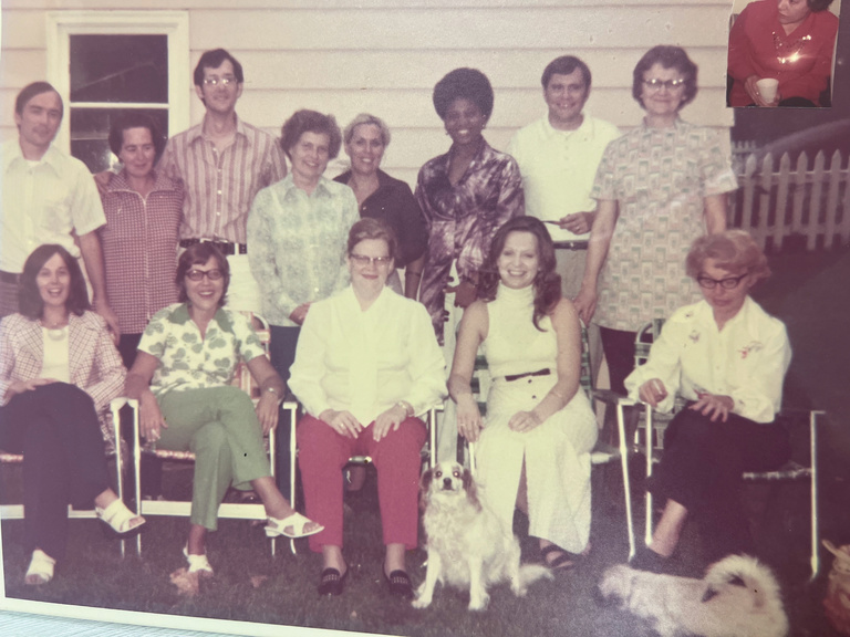 group of MA students in a backyard, posing for group photo